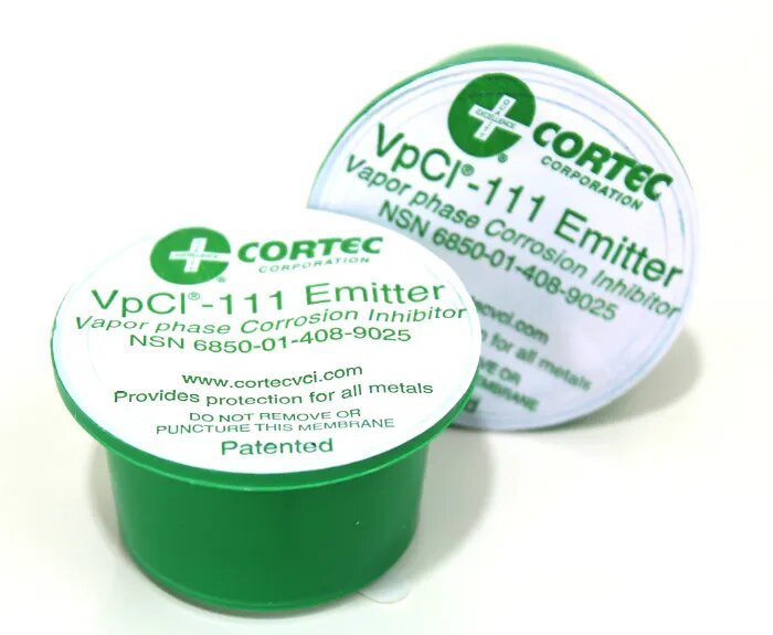 Two Cortec VpCI-111 emitter cups with green bases