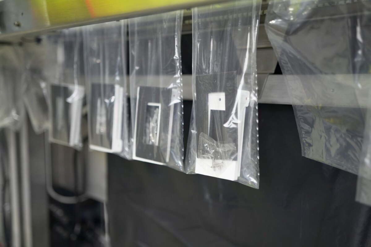Row of open SidePouch bags hanging on an Industrial SPrint SidePouch bagger